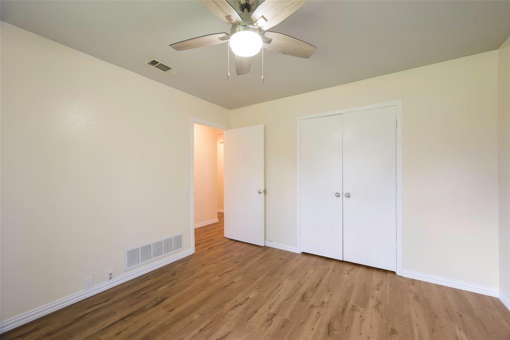6512 Mc Cormick Ranch Court Plano, TX 75023 - Photo 21 of 29 a view of an empty room with wooden floor