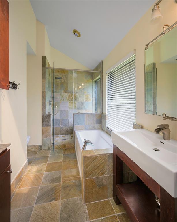 6512 Mc Cormick Ranch Court Plano, TX 75023 - Photo 24 of 29 a bathroom with a tub sink and a mirror