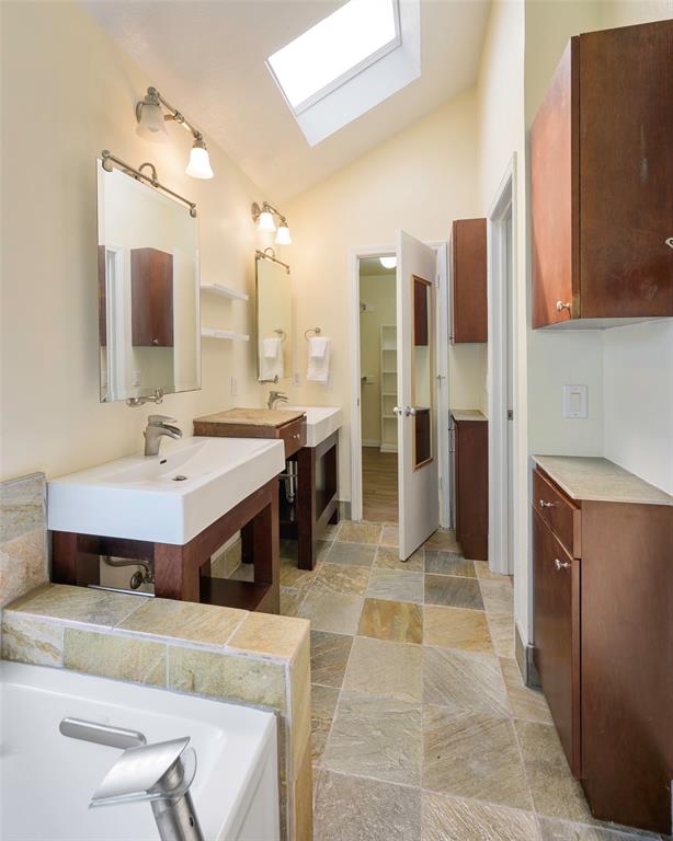 6512 Mc Cormick Ranch Court Plano, TX 75023 - Photo 25 of 29 a spacious bathroom with a tub double vanity and a mirror