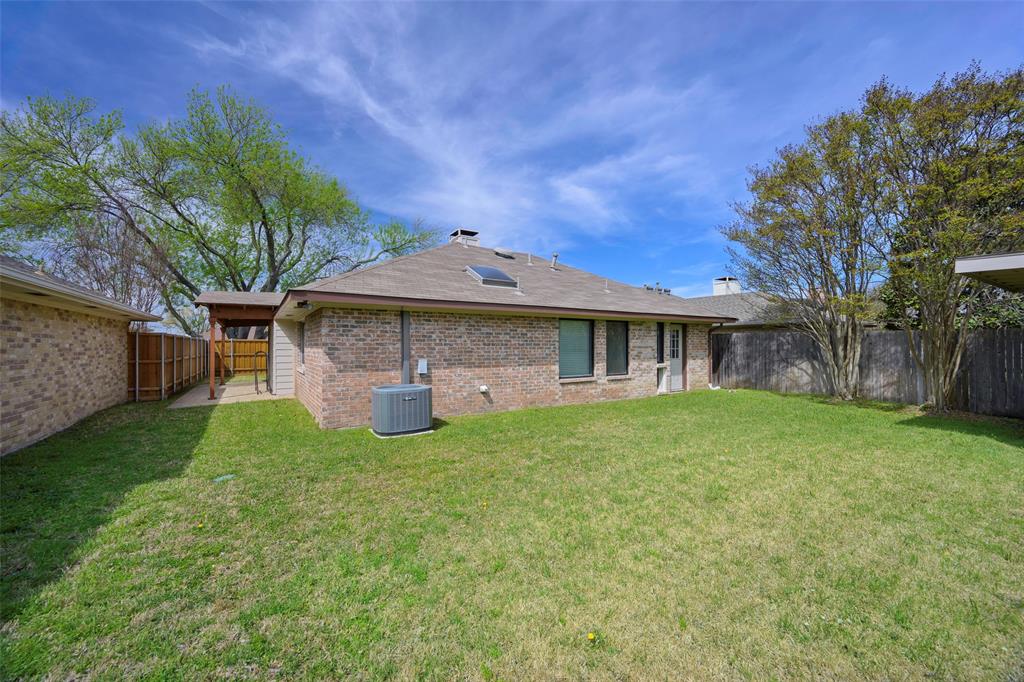 6512 Mc Cormick Ranch Court Plano, TX 75023 - Photo 28 of 29 a front view of a house with a garden and plants