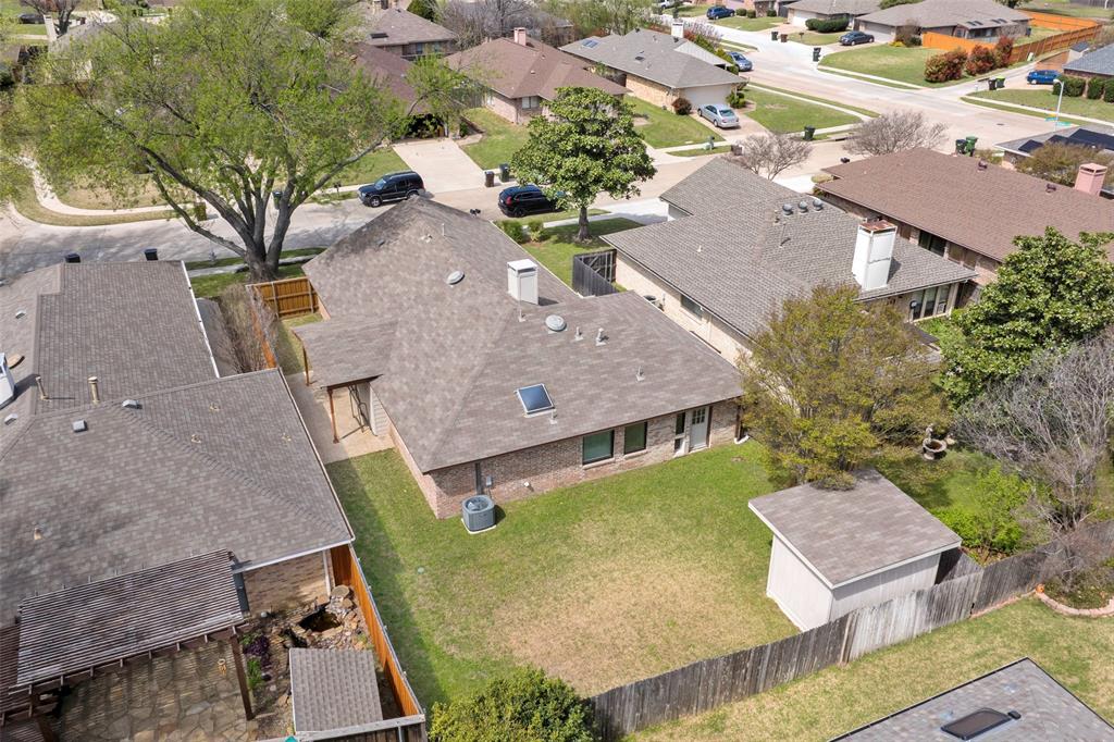6512 Mc Cormick Ranch Court Plano, TX 75023 - Photo 29 of 29 an aerial view of a house with garden space and a patio