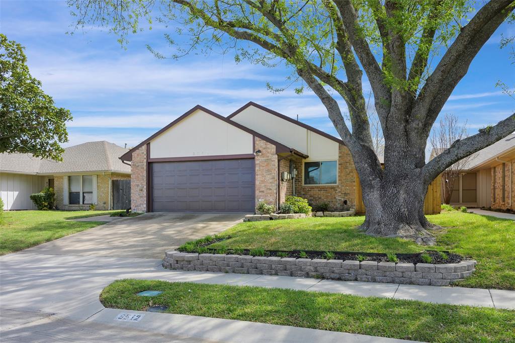 6512 Mc Cormick Ranch Court Plano, TX 75023 - Photo 3 of 29 a front view of a house with a yard and garage