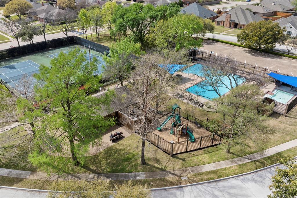 6512 Mc Cormick Ranch Court Plano, TX 75023 - Photo 5 of 29 a view of a garden with a fountain