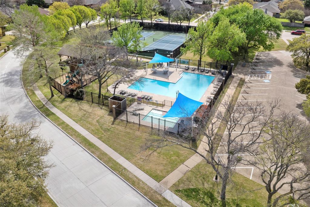 6512 Mc Cormick Ranch Court Plano, TX 75023 - Photo 7 of 29 a view of a swimming pool with lounge chairs