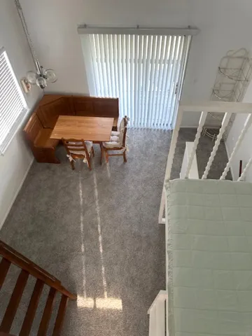 a view of livingroom with furniture and staircase