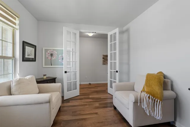 a living room with furniture and a rug