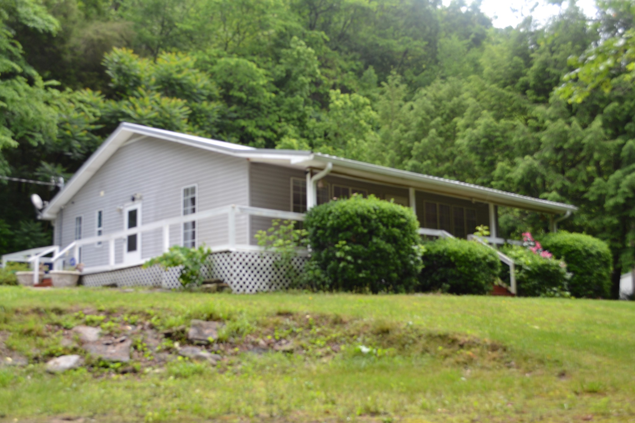 1505 Add Stafford Road Hilham, TN 38568 - Photo 38 of 65 a front view of a house with garden