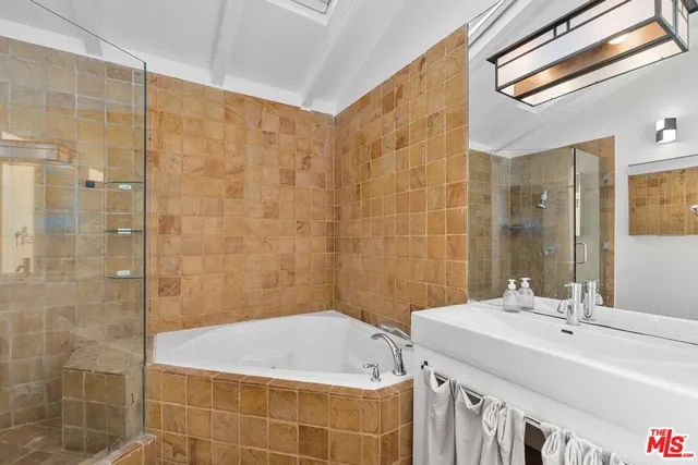 a bathroom with a bathtub and sink