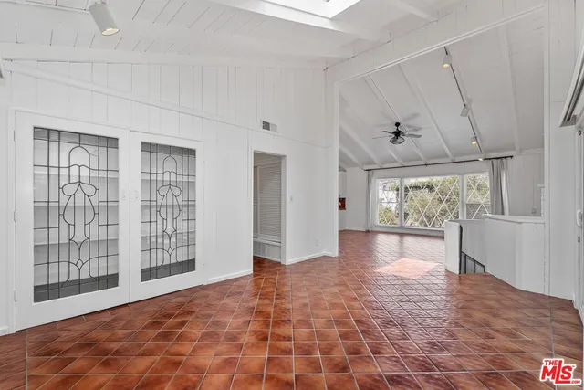 a view of livingroom with window and wooden floor