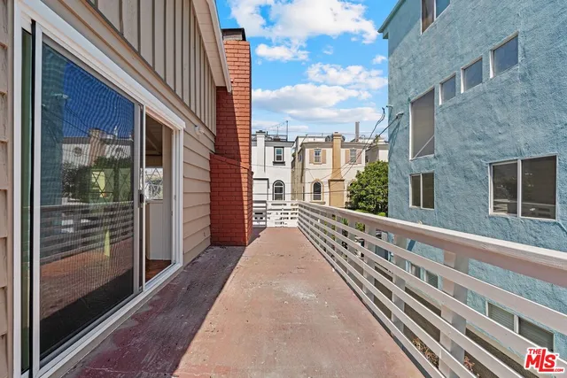 a view of a balcony with a large tree