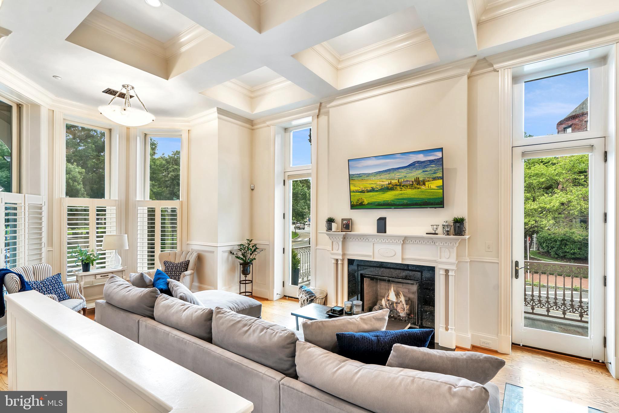 4 Logan Circle Northwest, Unit 1 Washington, DC 20005 - Photo 1 of 15 Light-filled living room with gas fire place.