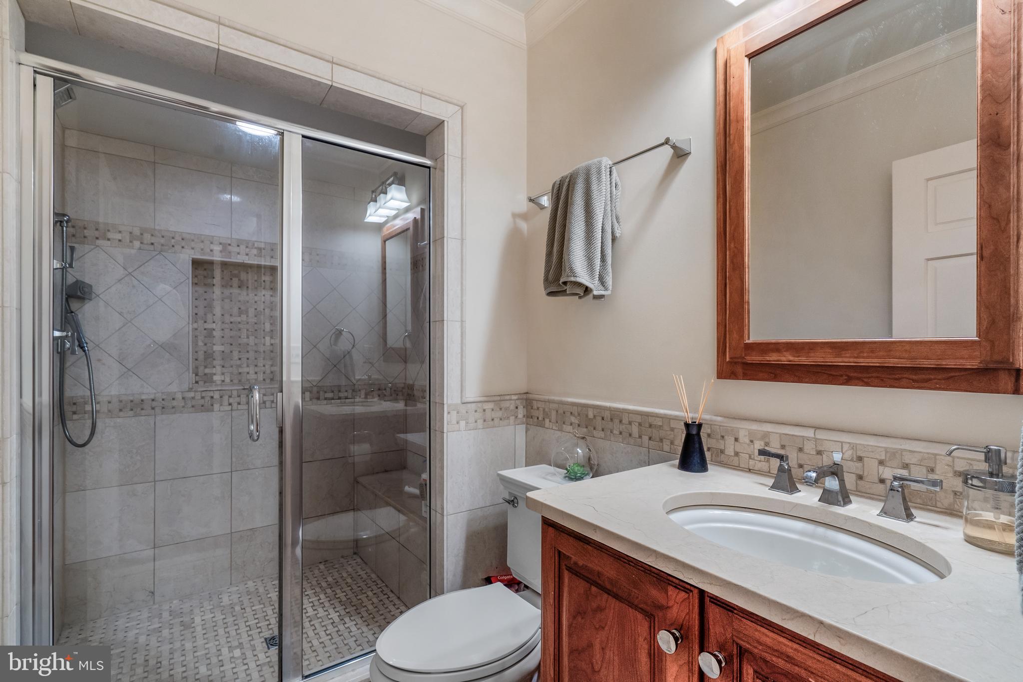 4 Logan Circle Northwest, Unit 1 Washington, DC 20005 - Photo 11 of 15 En-suite bathroom with sleek tilework.