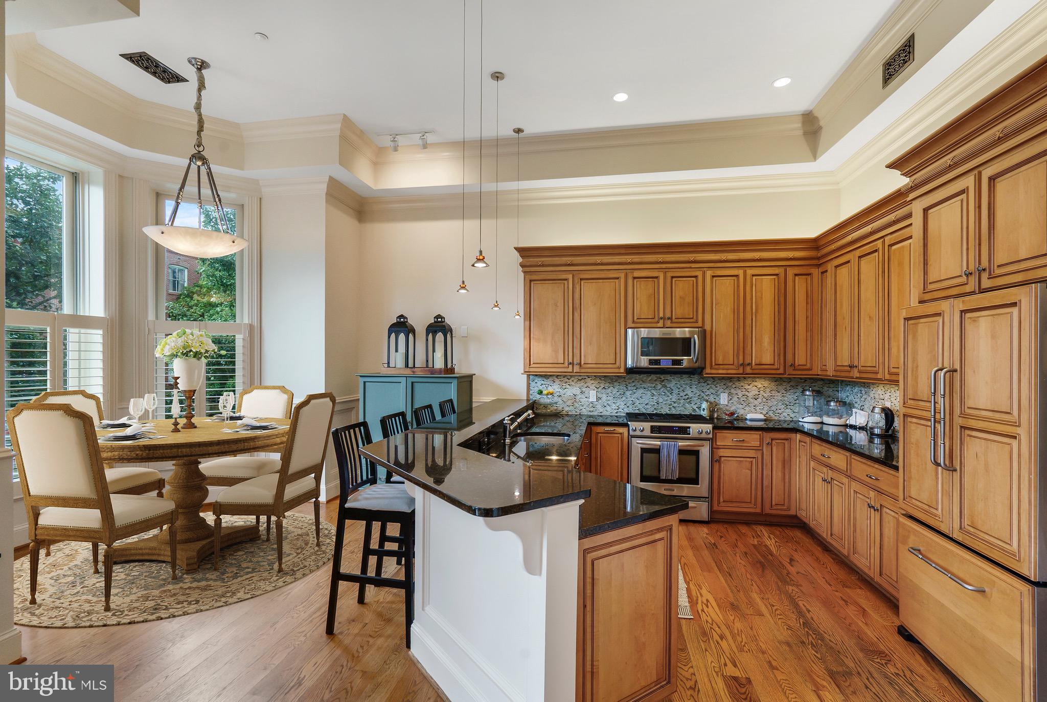 4 Logan Circle Northwest, Unit 1 Washington, DC 20005 - Photo 3 of 15 Large chef's kitchen with dining space.