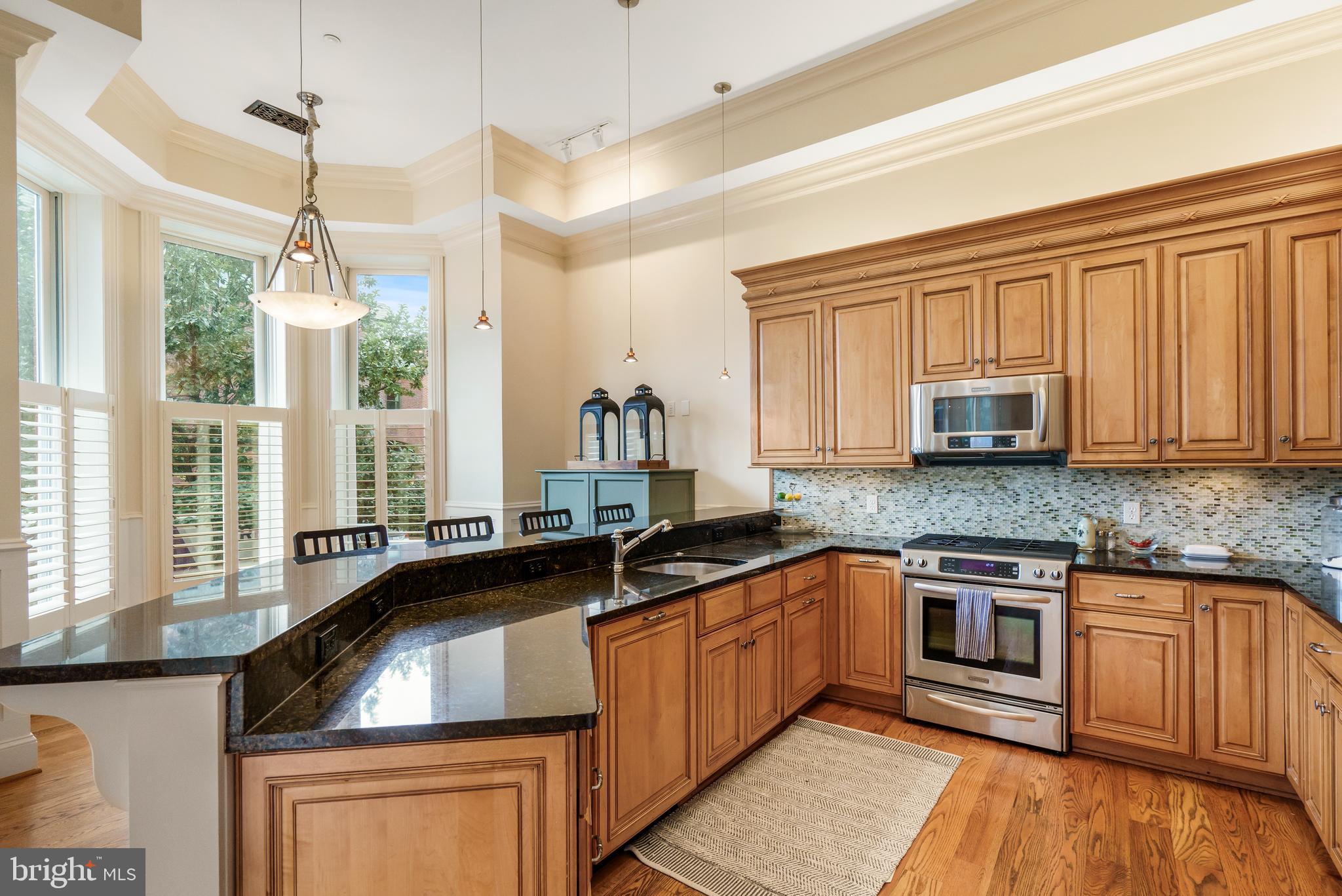 4 Logan Circle Northwest, Unit 1 Washington, DC 20005 - Photo 5 of 15 Stainless steel appliances and plenty of storage.