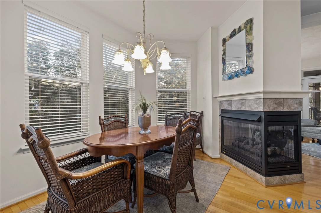 3973 West Stratford Road Virginia Beach, VA 23455 - Photo 12 of 45 a view of a dining room with furniture window and wooden floor