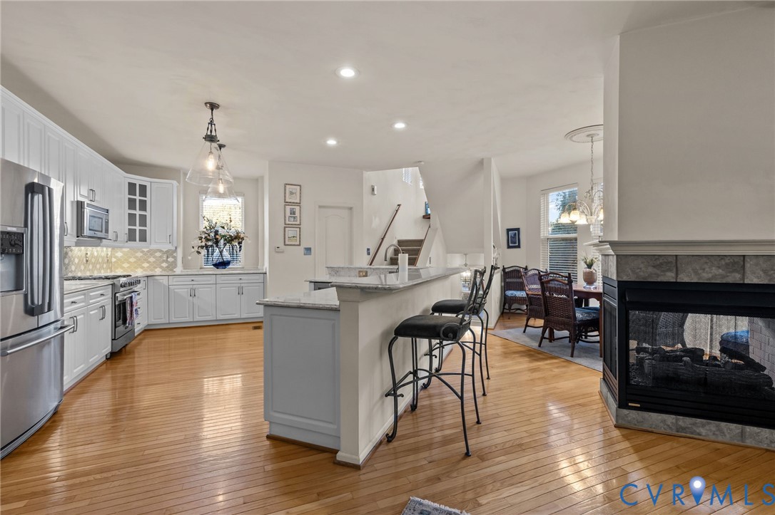 3973 West Stratford Road Virginia Beach, VA 23455 - Photo 13 of 45 a large kitchen with a table and chairs in it
