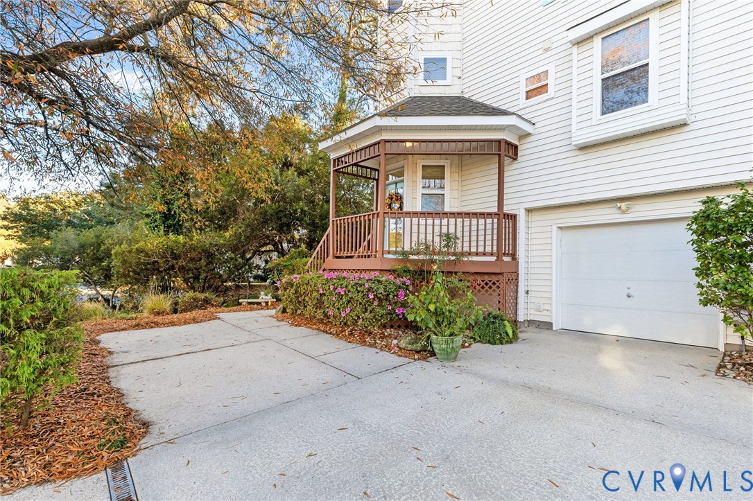 3973 West Stratford Road Virginia Beach, VA 23455 - Photo 2 of 45 a front view of a house with a yard and garage