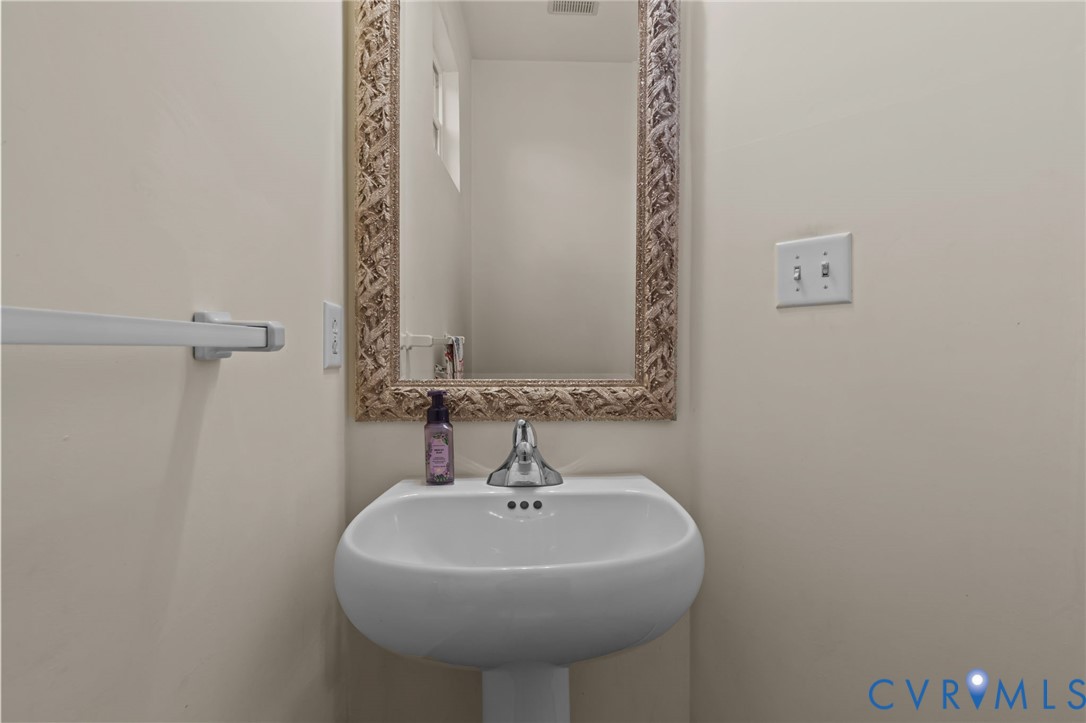 3973 West Stratford Road Virginia Beach, VA 23455 - Photo 20 of 45 a bathroom with a sink and a mirror