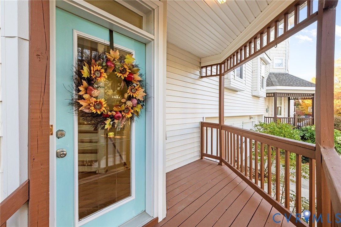 3973 West Stratford Road Virginia Beach, VA 23455 - Photo 8 of 45 a view of a porch with wooden floor and front door