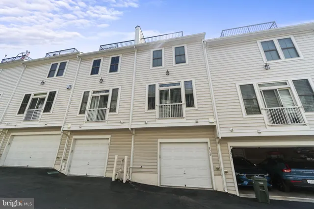 a front view of a building with many windows