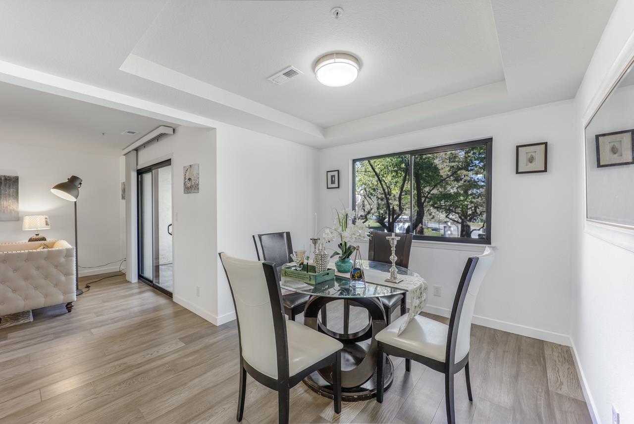 1126 Woodside Road Redwood City, CA 94061 - Photo 5 of 50 a view of a dining room with furniture and wooden floor