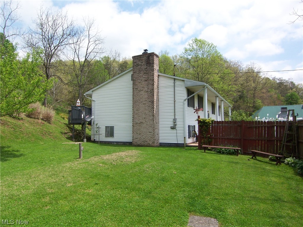 99 Progress Ridge Road Walker, WV 26180 - Photo 22 of 29 Side of house. Location of septic tank.