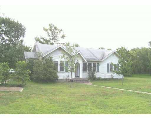 307 Taylor Road Elgin, TX 78621 - Photo 1 of 1 a front view of a house with a garden and plants