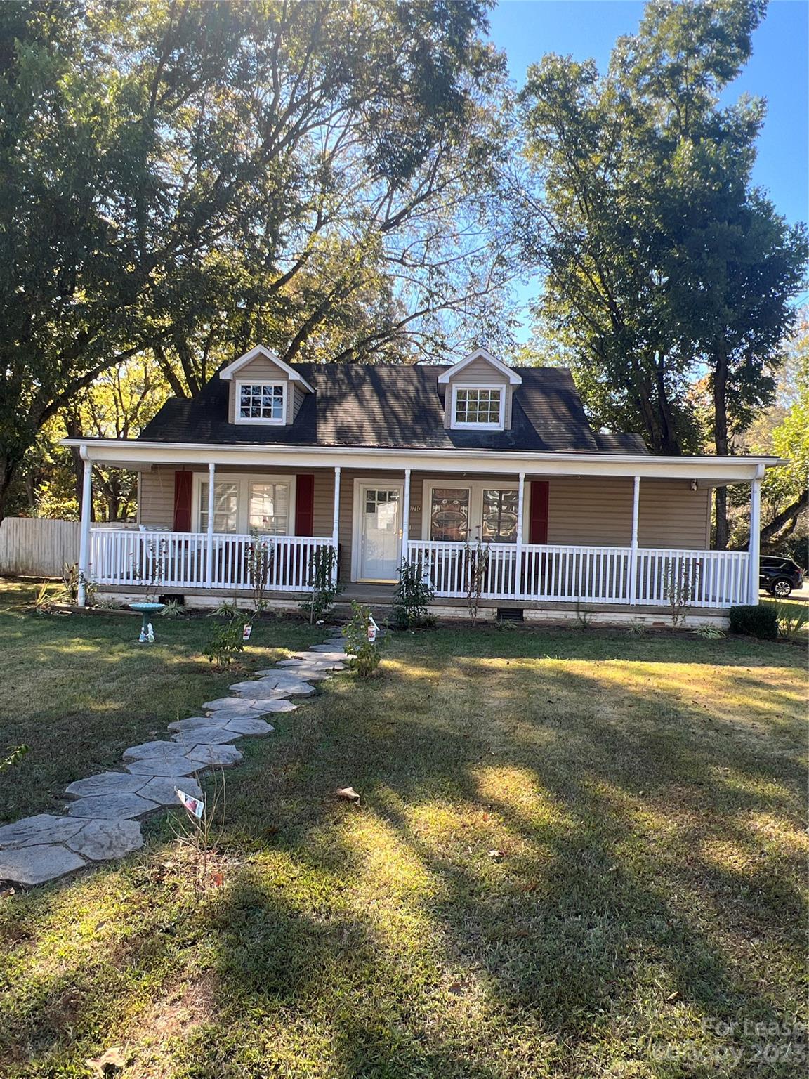 front view of a house with a swimming pool