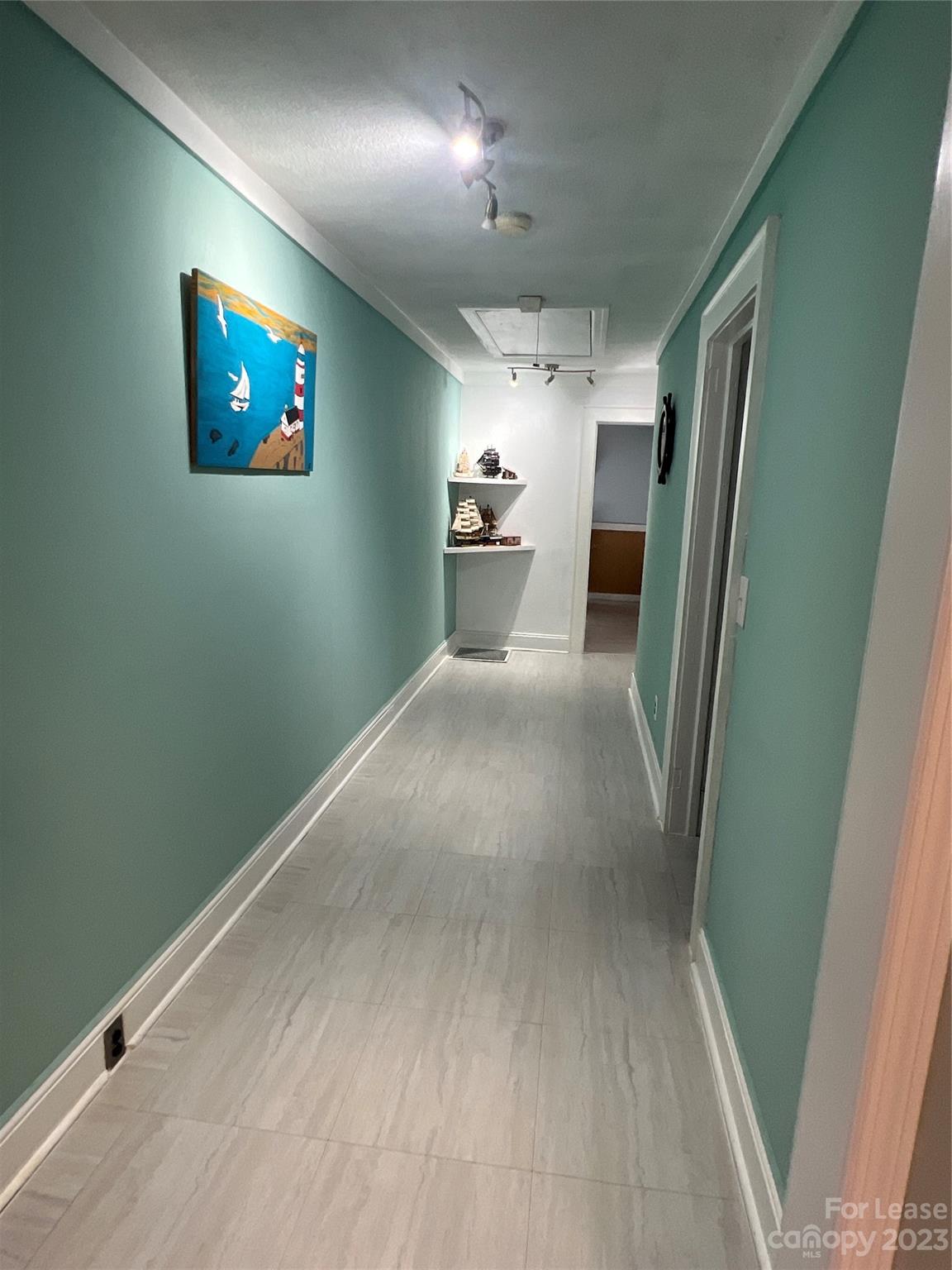 1710 King Road Shelby, NC 28150 - Photo 11 of 20 a view of a hallway with wooden floor and a bathroom