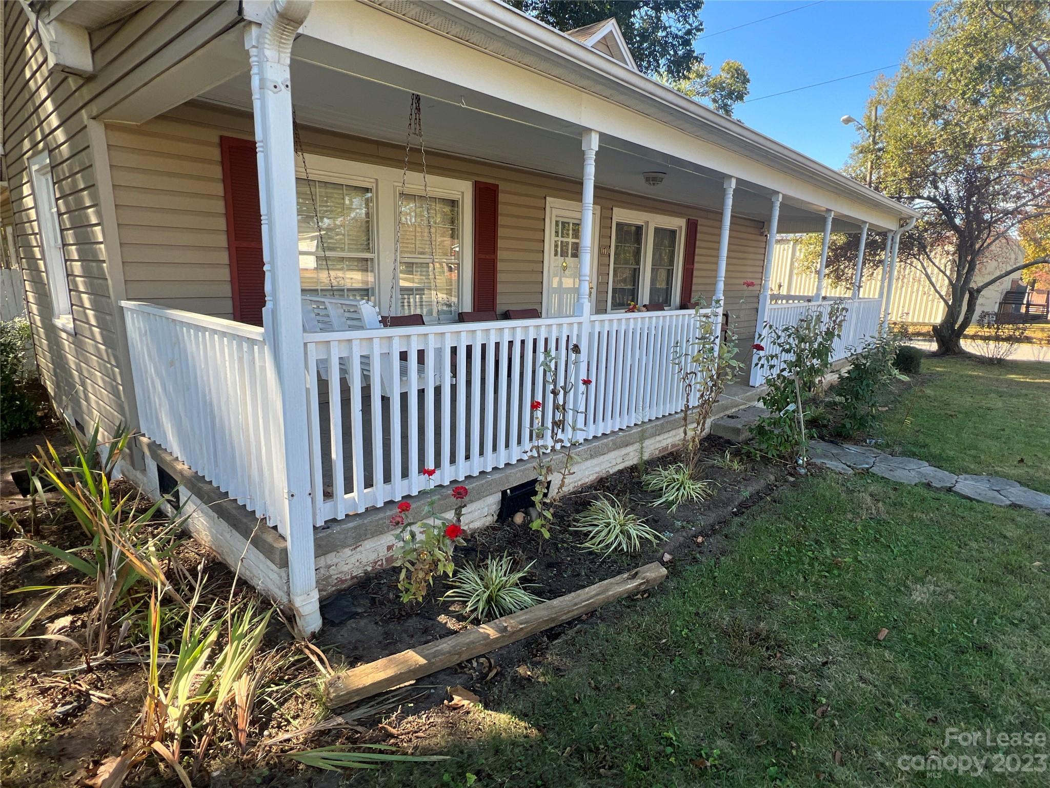 1710 King Road Shelby, NC 28150 - Photo 3 of 20 a view of a house with a small yard and flower plants
