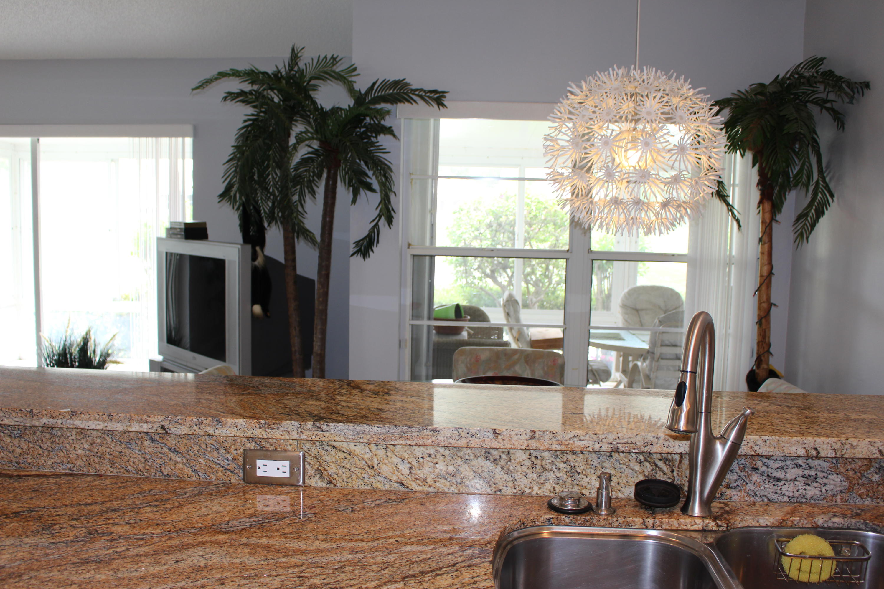 10012 Country Brook Road Boca Raton, FL 33428 - Photo 16 of 25 a view of a living room with furniture and a potted plant