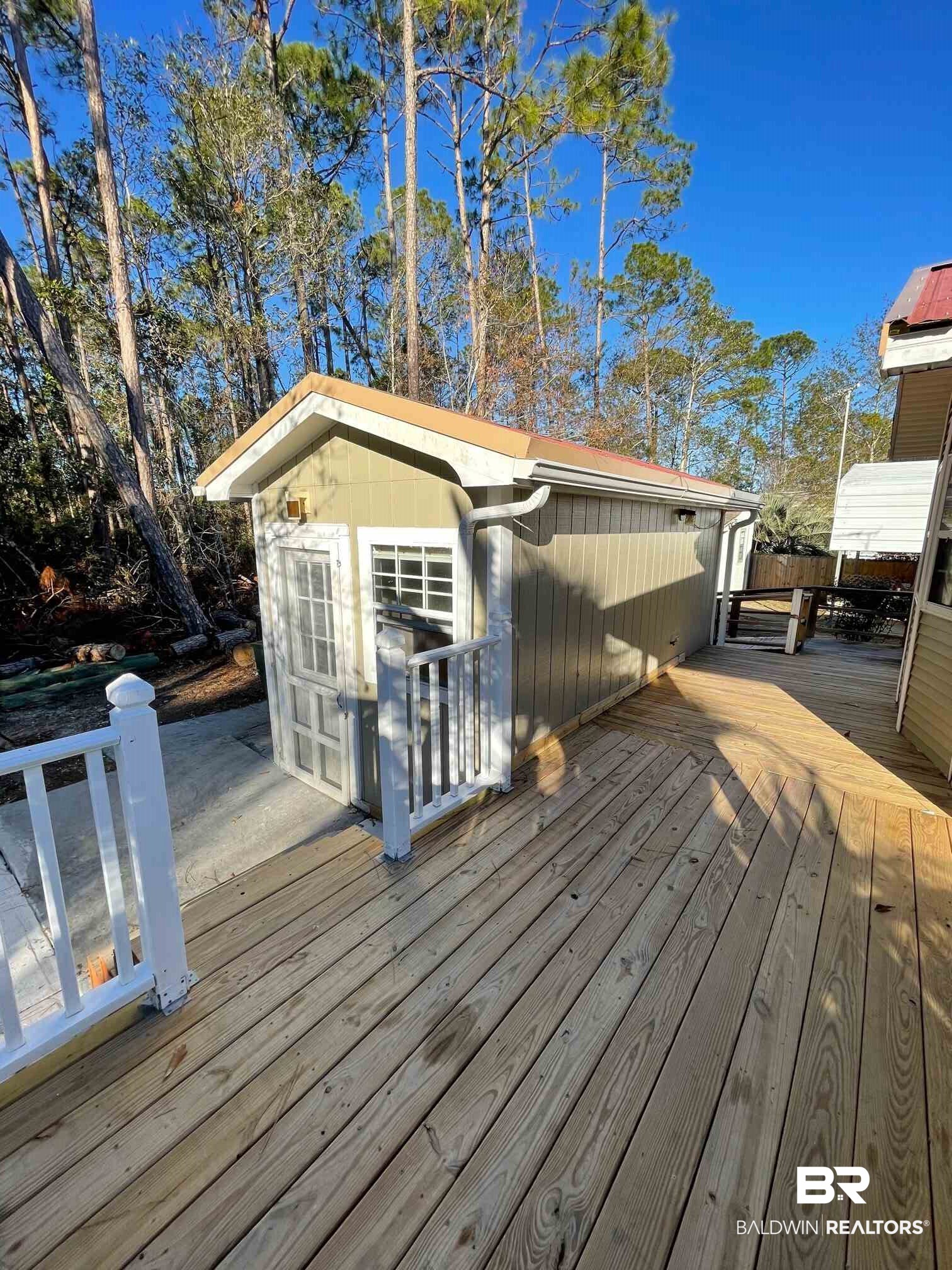 186 Defuniak Loop Lillian, AL 36549 - Photo 15 of 20 Wrap-around deck leading to laundry room.