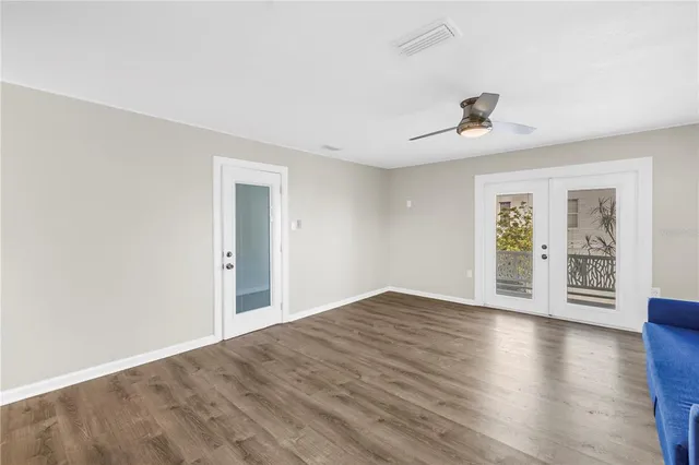 a kitchen with stainless steel appliances a refrigerator sink and wooden cabinets