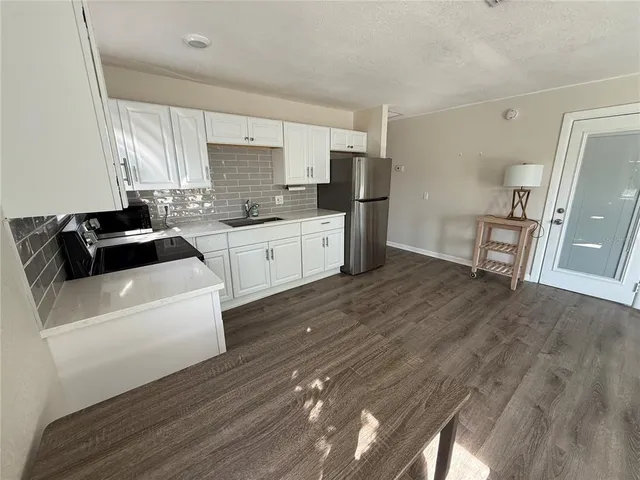 a living room with furniture and windows