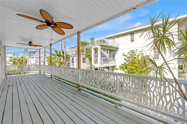 a view of a balcony with wooden floor
