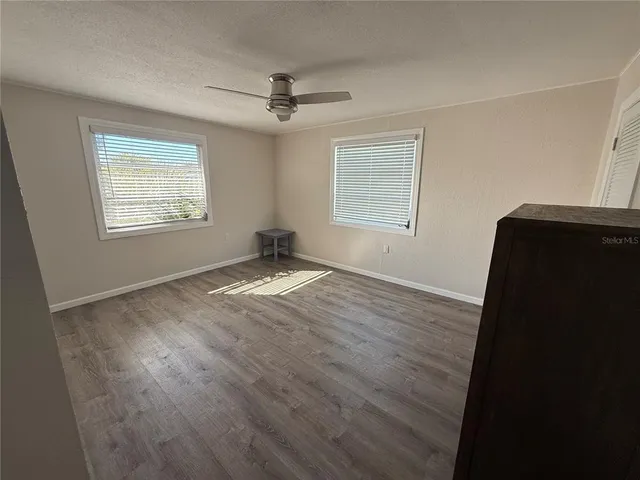 an aerial view of a house with a yard and potted plants