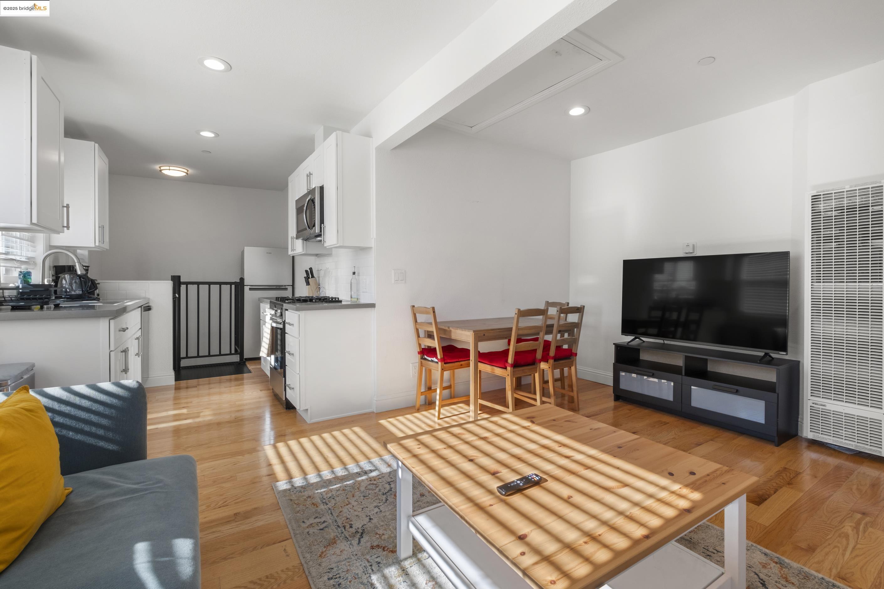 1628 Tyler Street Berkeley, CA 94703 - Photo 11 of 38 a living room with furniture and a flat screen tv