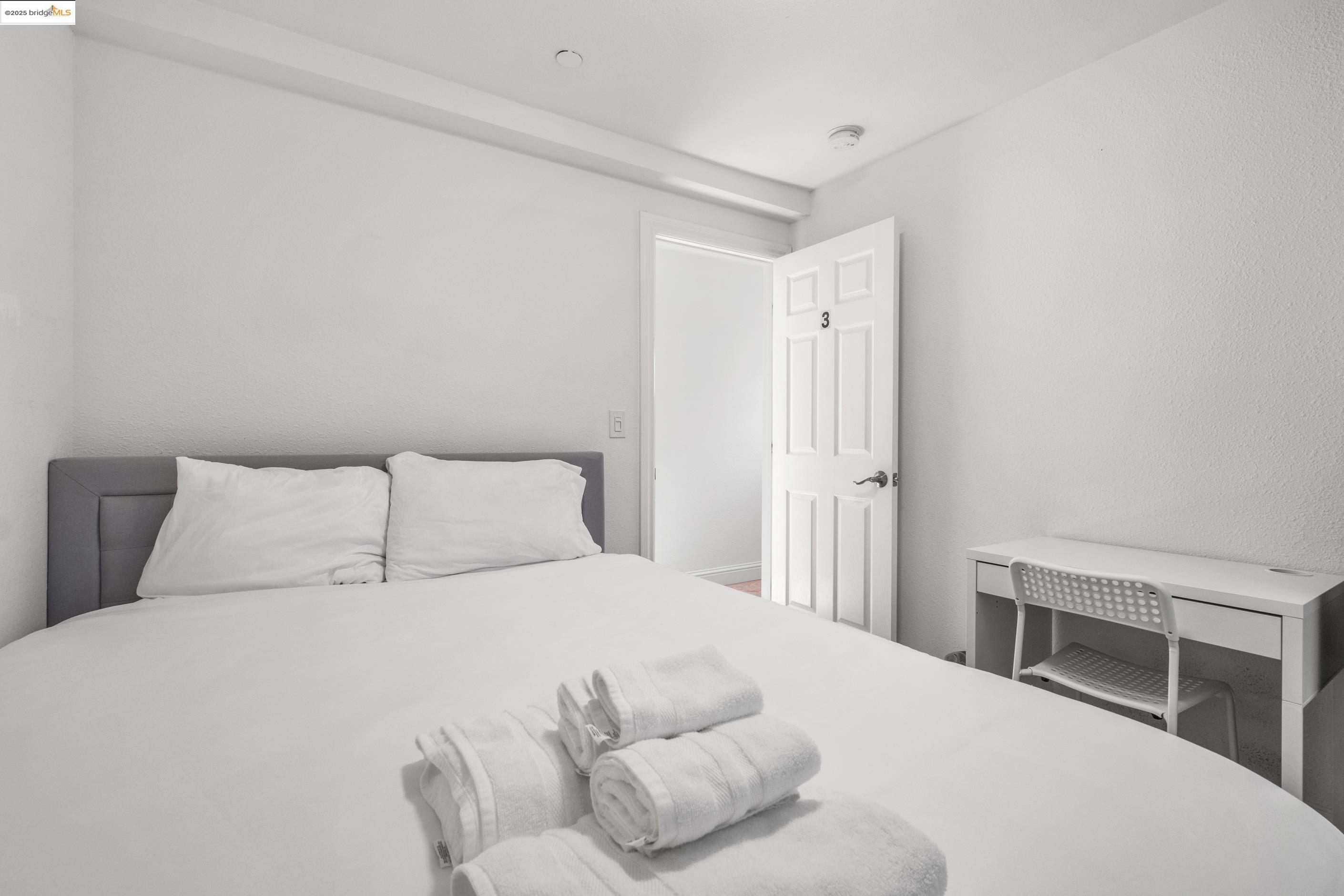 1628 Tyler Street Berkeley, CA 94703 - Photo 15 of 38 a bedroom with a bed and a desk