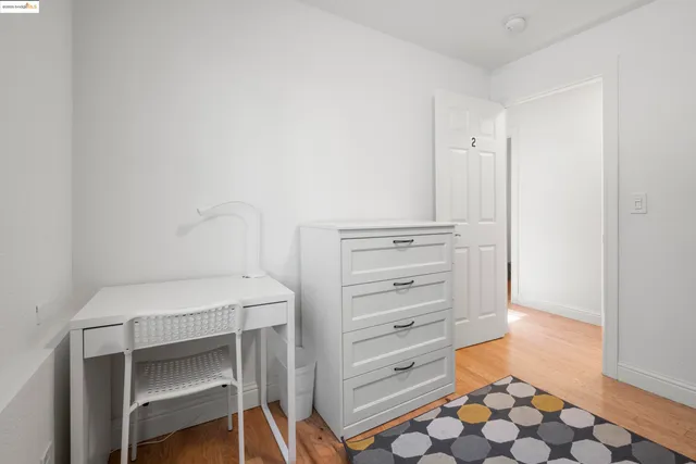 a bedroom with a bed and a cabinets
