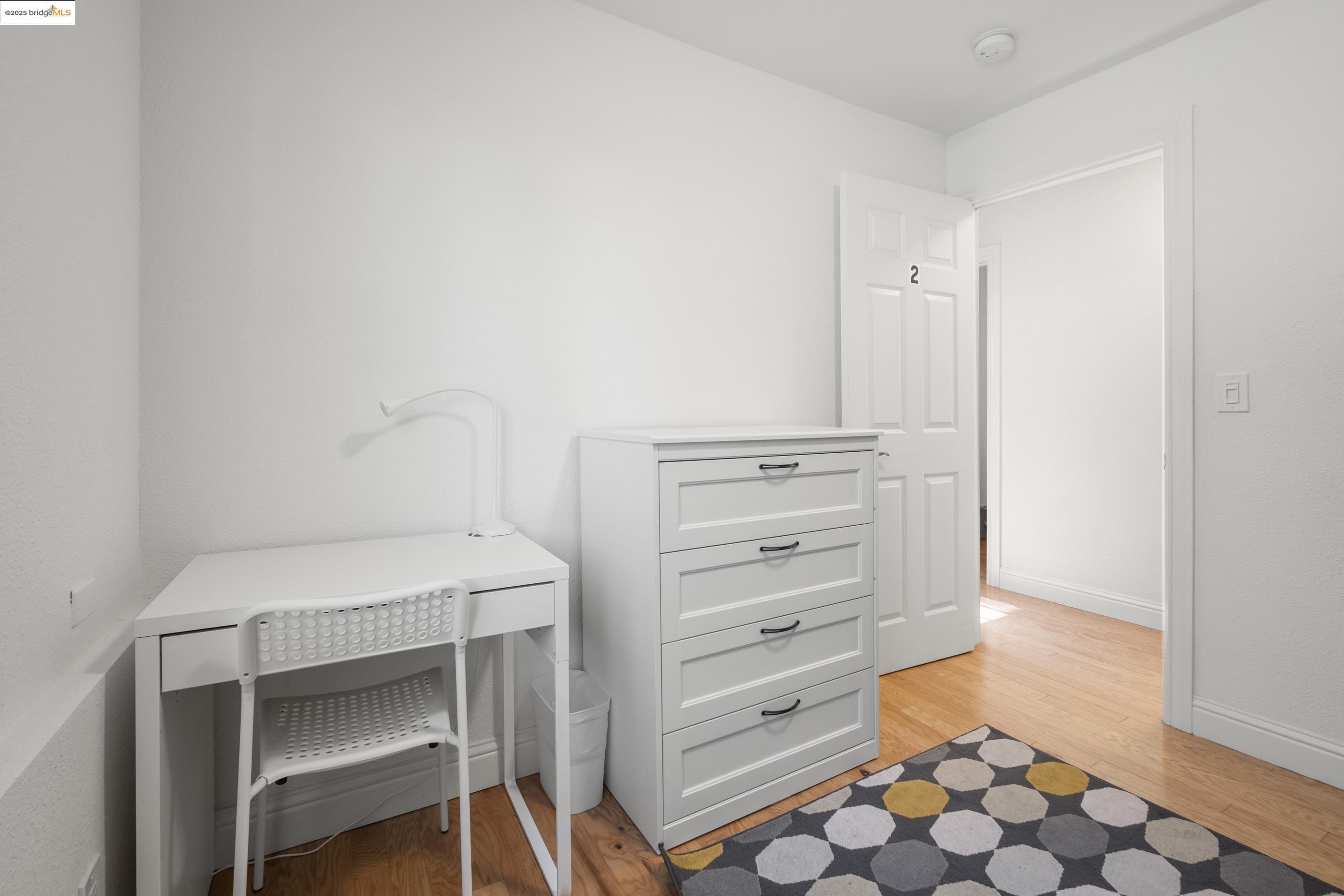 1628 Tyler Street Berkeley, CA 94703 - Photo 16 of 38 a bedroom with a bed and a cabinets