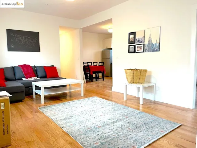 a living room with furniture and a rug