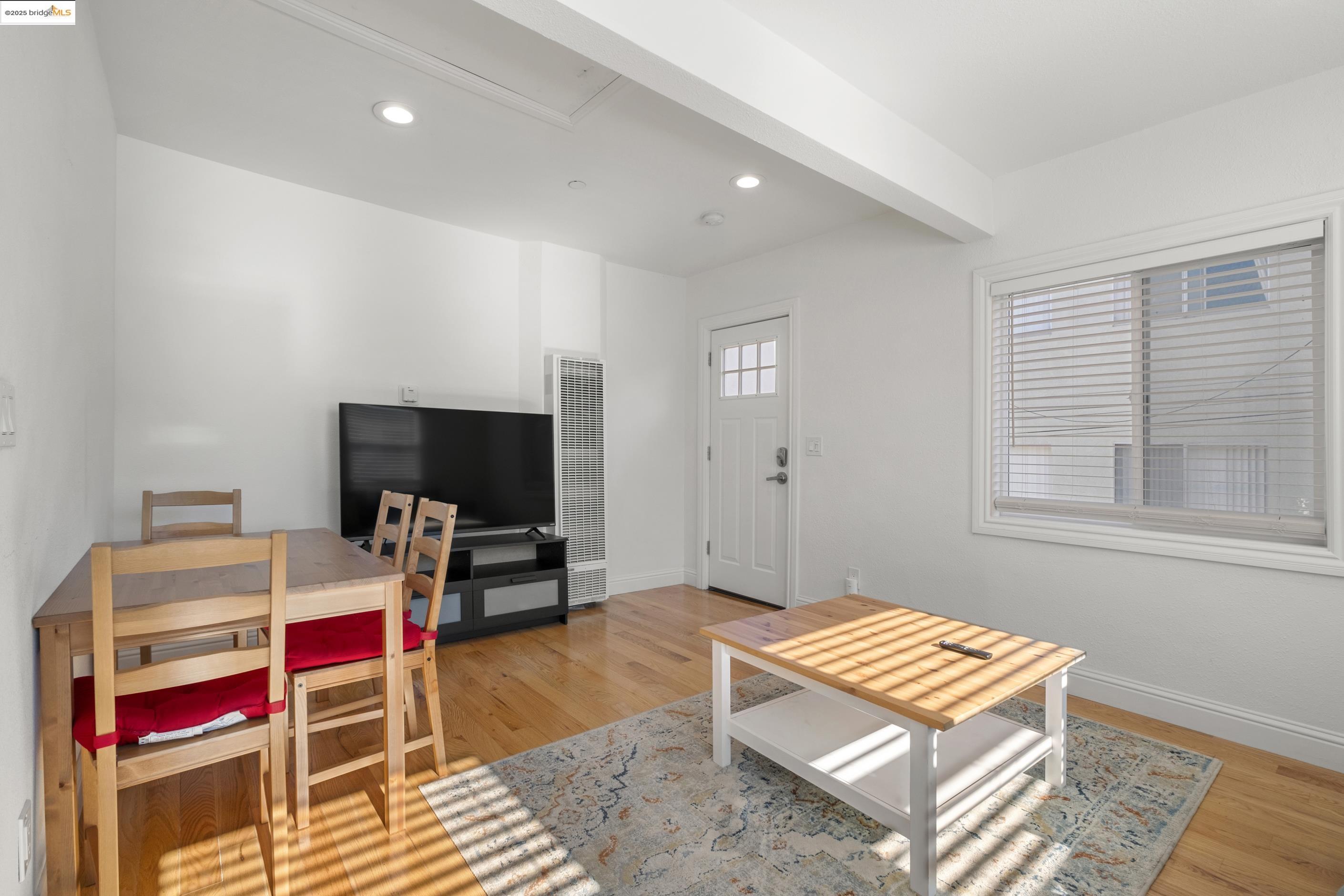 1628 Tyler Street Berkeley, CA 94703 - Photo 9 of 38 a living room with furniture and a flat screen tv