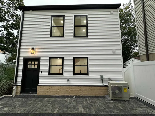 a front view of a house with garage