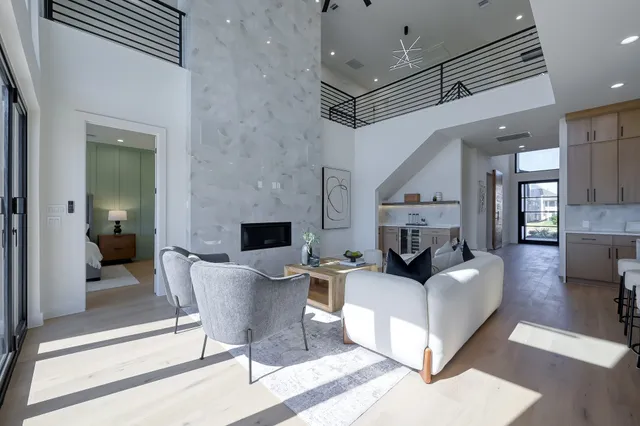 a living room with fireplace furniture and a fireplace