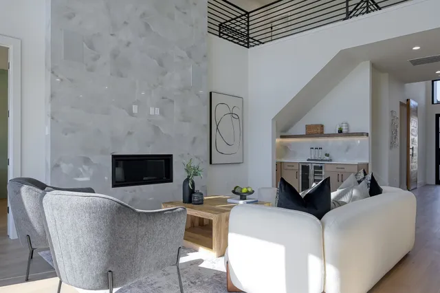 a living room with furniture and a fireplace