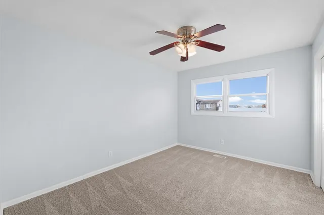 a view of a big room with wooden floor in a living room