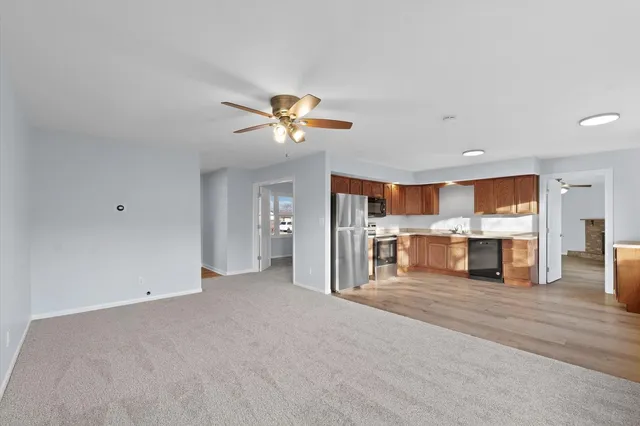 a view of a kitchen with a sink and a chandelier