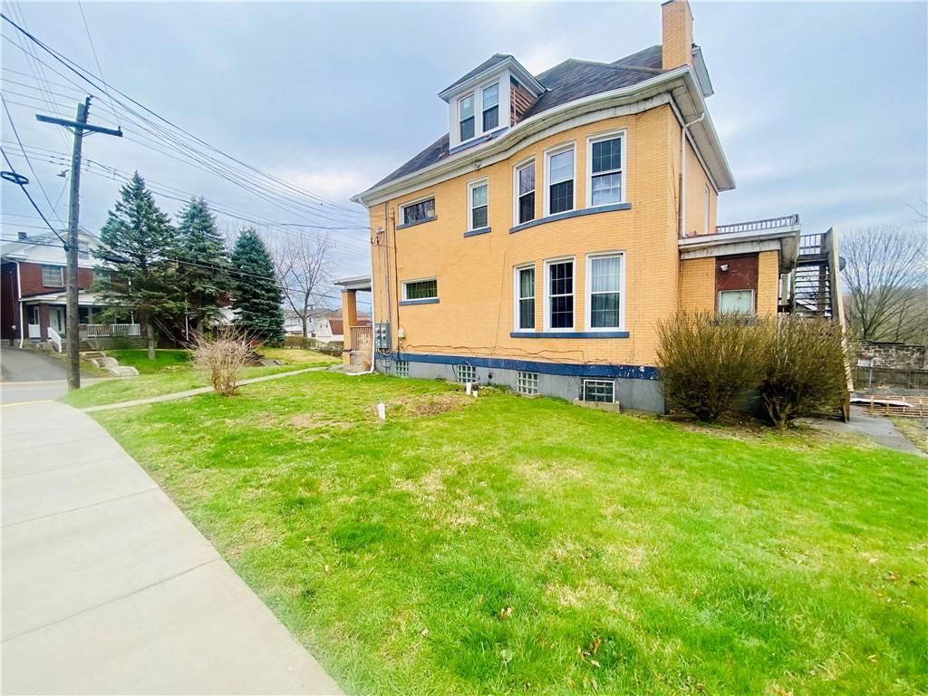 2602 Main Street Munhall, PA 15120 - Photo 2 of 21 a front view of a house with a yard