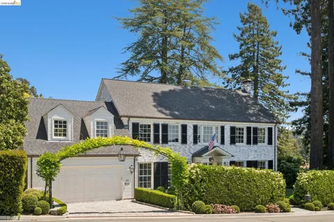 front view of a house with a garden