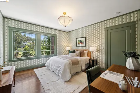 a spacious bedroom with a bed and a view of bathroom